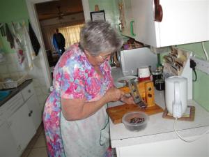 Tannie Geza, cutting some biltong for me to take with me on my trip back