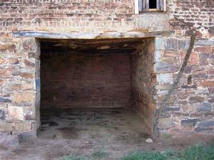 A garage of yesteryear: This is where the Ox-Wagon was kept. Note the upper bricked section...a later addition.