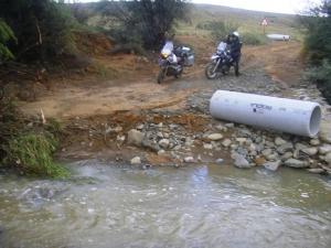 This road was DEFINITELY closed!: The Tankwa flowing freely without a bridge, 1-2metre high banks of mud