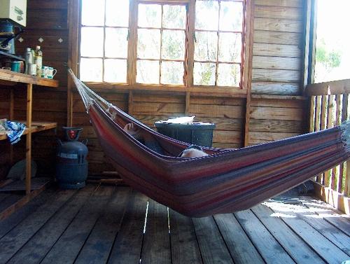 Andy dozes off in the hammock at the hut