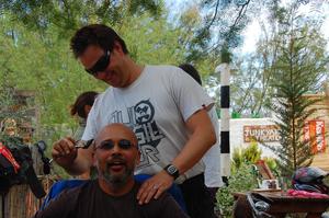 Haircut: Sean giving Shah a much needed haircut