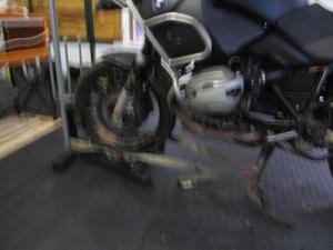 place bike in man-cave on centre stand, winch in the front wheel chock