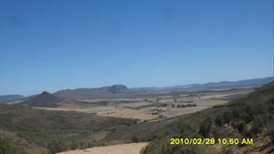 From Banghoek farm overlooking the Sandveld: Taken on the trot by my pillion, Kapteinsklip pass is apache sand country
