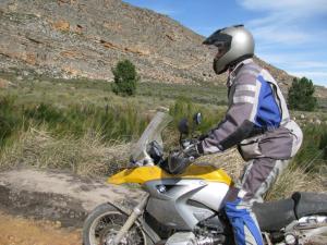 Jaco on his new bike: braces himself for a tricky river crossing